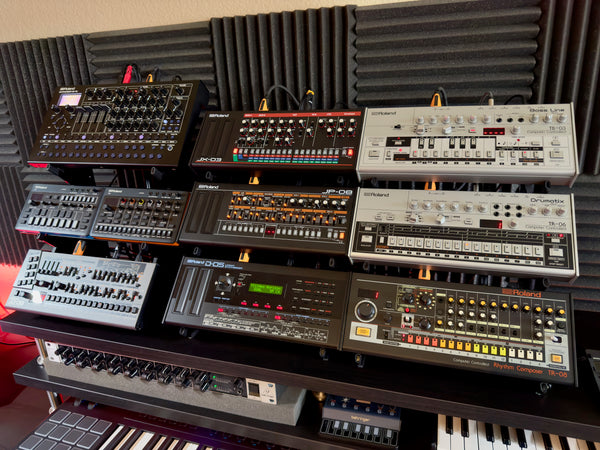 Three KVgear Boo-3 stands holding Roland Boutiques and Compact, plus SH-4.