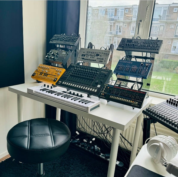 Two KVgear Utility M3 stands holding Roland Boutiques, TD-3, Nymphes.  Also KVgear Adapt L2 holding TR-8S and TB-303