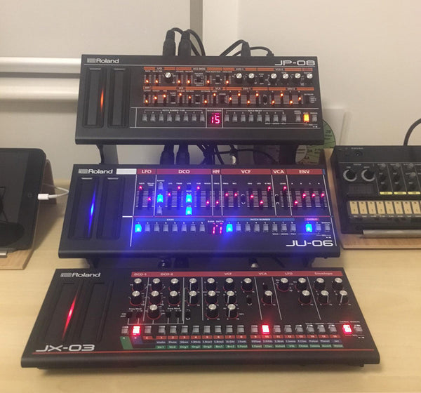 Two tier Roland Boutique stand with a third Boutique flat on table in front (KVgear Boo-2)