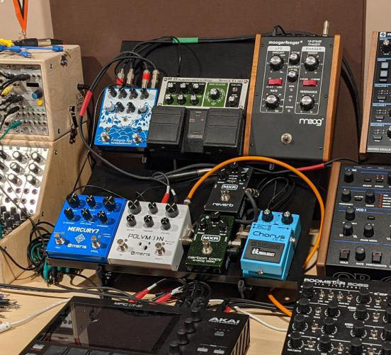 Synth effects pedals on two KVgear Expansion Shelf Large on Adapt L2 stand.