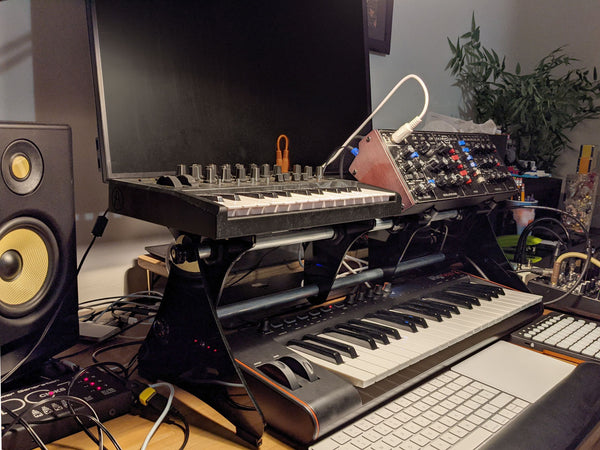 KVgear Gear Rail holding Microbrute and Model D above MIDI keyboard