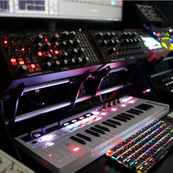 Moog Subharmonicon and DFAM on KVgear Gear Rail stand above Keystep Pro.