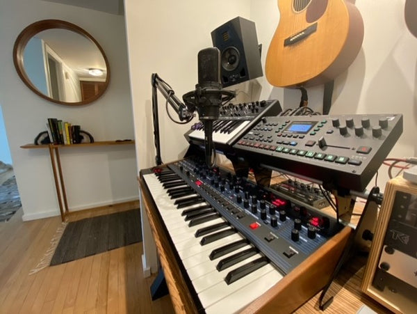 KVgear Gear Rail holding Novation AFX Station and Elektron Rytm MkII above Sequential OB-6