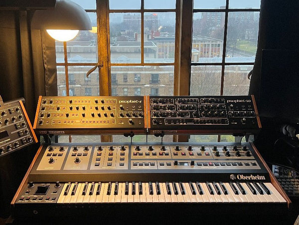 Sequential P5 and P10 desktop synths on KVgear Gear Rail above Oberheim OBX8.