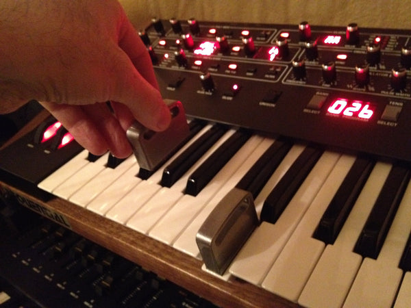 Key holder weight in use on Prophet 6 keyboard.