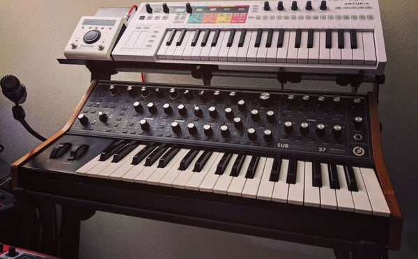 Keystep Pro and Eventide H9 pedal held above Moog Sub37 by KVgear SubPiggy stand