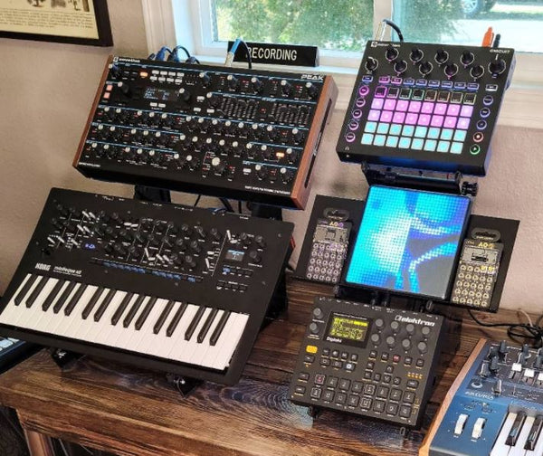 Expansion Shelf Medium holds Pocket Operators on Utility M3 desktop synth stand.