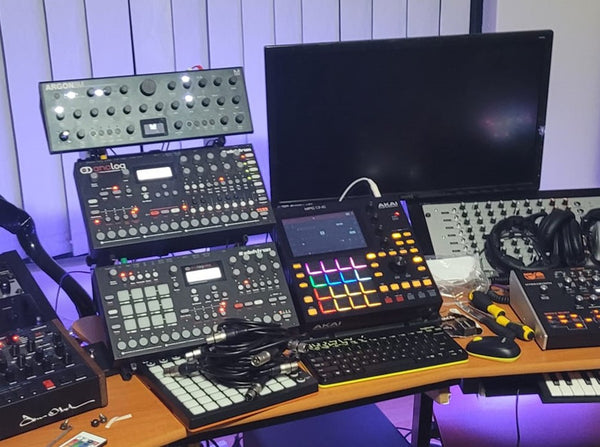 Elektron Analog Four, Elektron Octatrak, and Modal Argon8M on KVgear Utility M3 three tier stand rack.