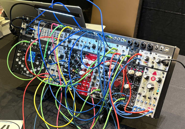 SynthRISE modular synth stand with Intellijel case.