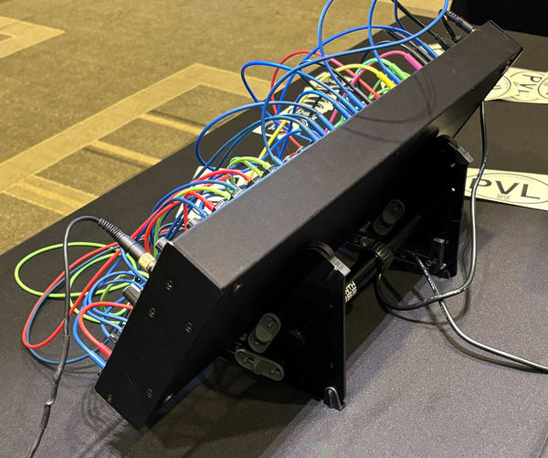 Rear corner view of SynthRISE modular synth stand with Intellijel case.