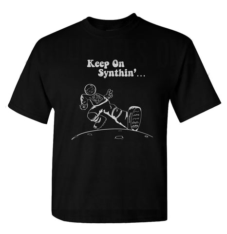 T-shirt with "Keep On Synthin'" and a cat astronaut strutting on the moon.